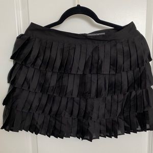 Black pleated mini skirt